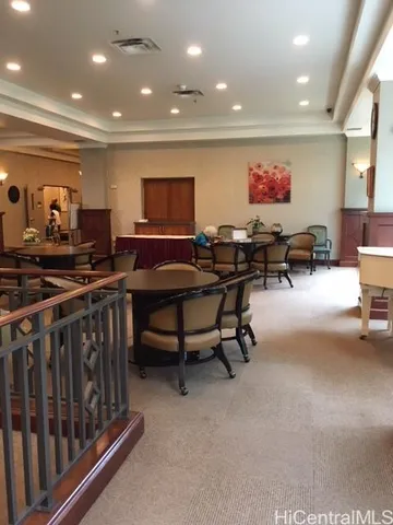 a living room with furniture a projector and a flat screen tv