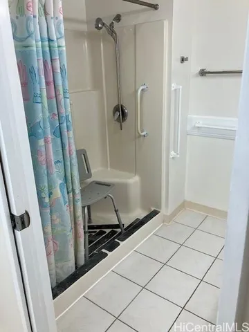 a view of a closet with wooden floor