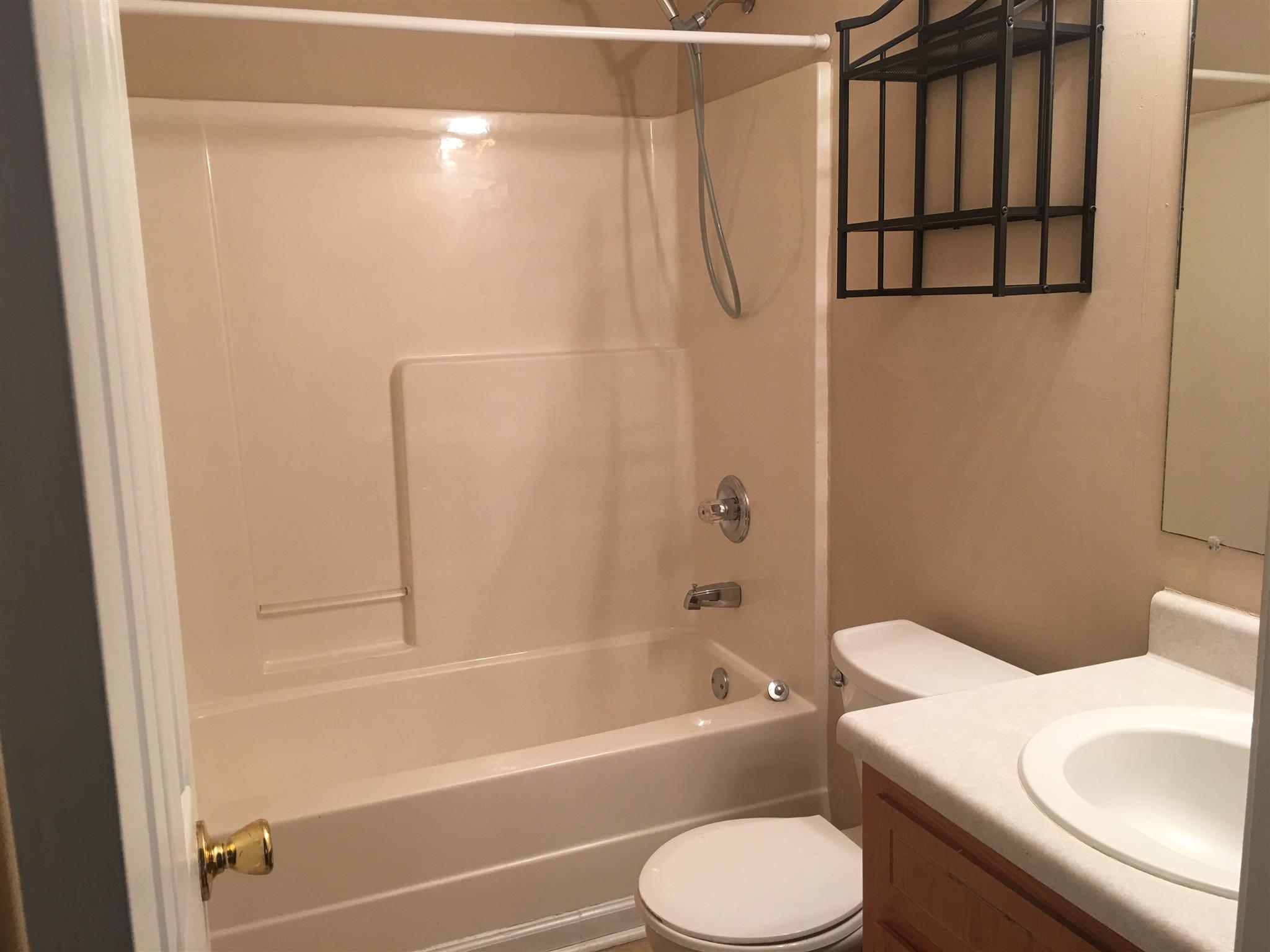 1126 Timothy Avenue Oak Grove, KY 42262 - Photo 11 of 12 a bathroom with a toilet and a shower