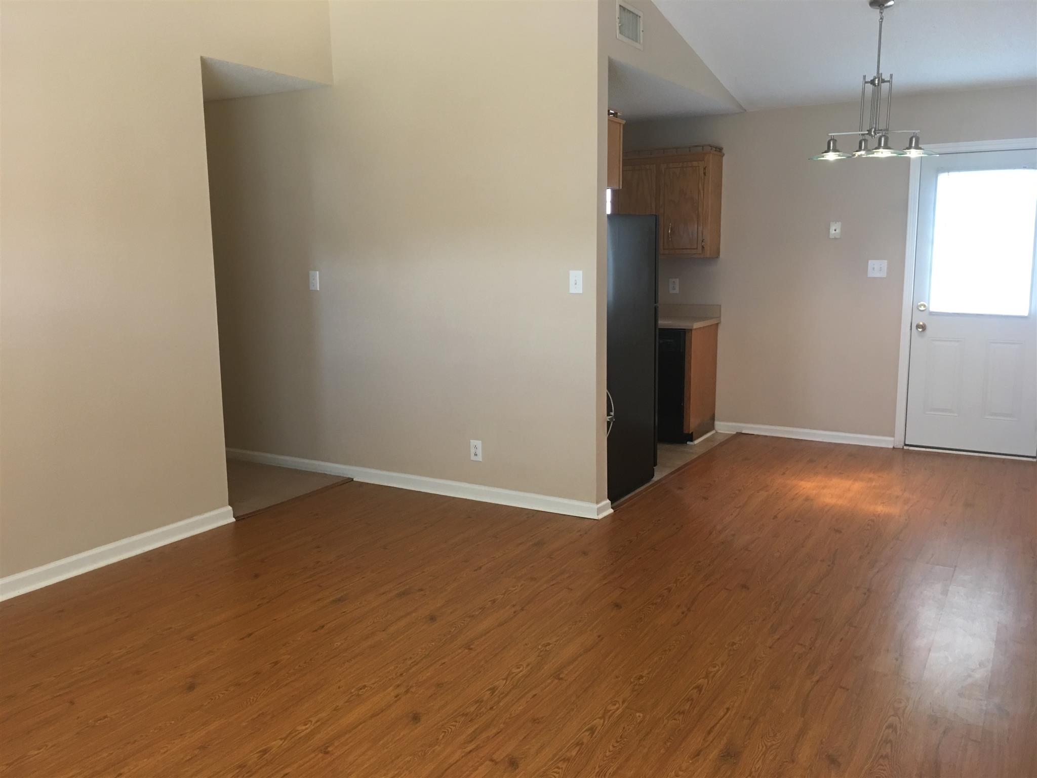 1126 Timothy Avenue Oak Grove, KY 42262 - Photo 5 of 12 an empty room with wooden floor and windows