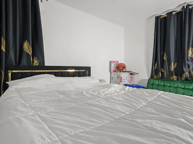 a white toilet sitting next to a shower curtain
