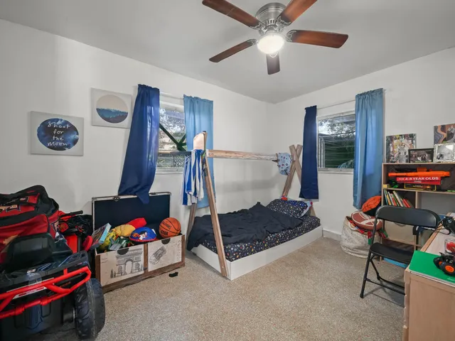 a bedroom with a bed and dresser