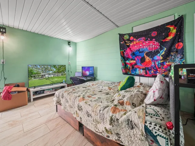 a white toilet sitting next to a bathroom sink and a shower