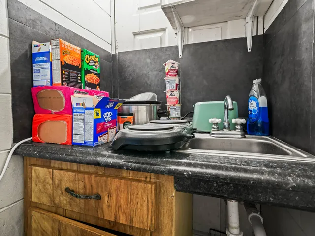 a view of a patio with a table chairs and a yard