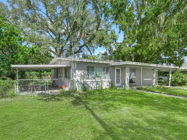a backyard of a house with seating space