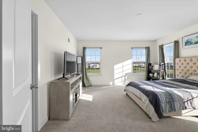 a bedroom with a bed and closet