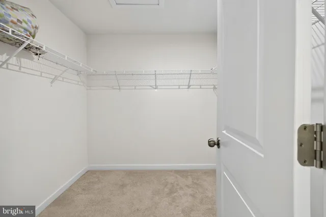 a bathroom with a granite countertop mirror and a sink