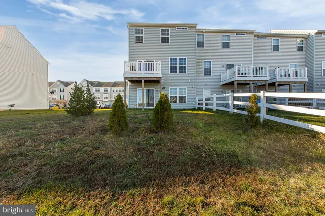 a large building with swimming pool in front of it
