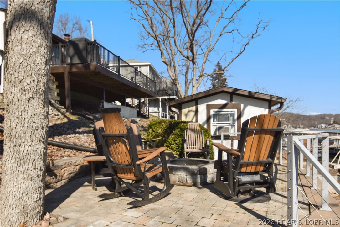 44 Oasis Point Camdenton, MO 65020 - Photo 6 of 55 Enjoy summer nights by the lakeside fire pit.