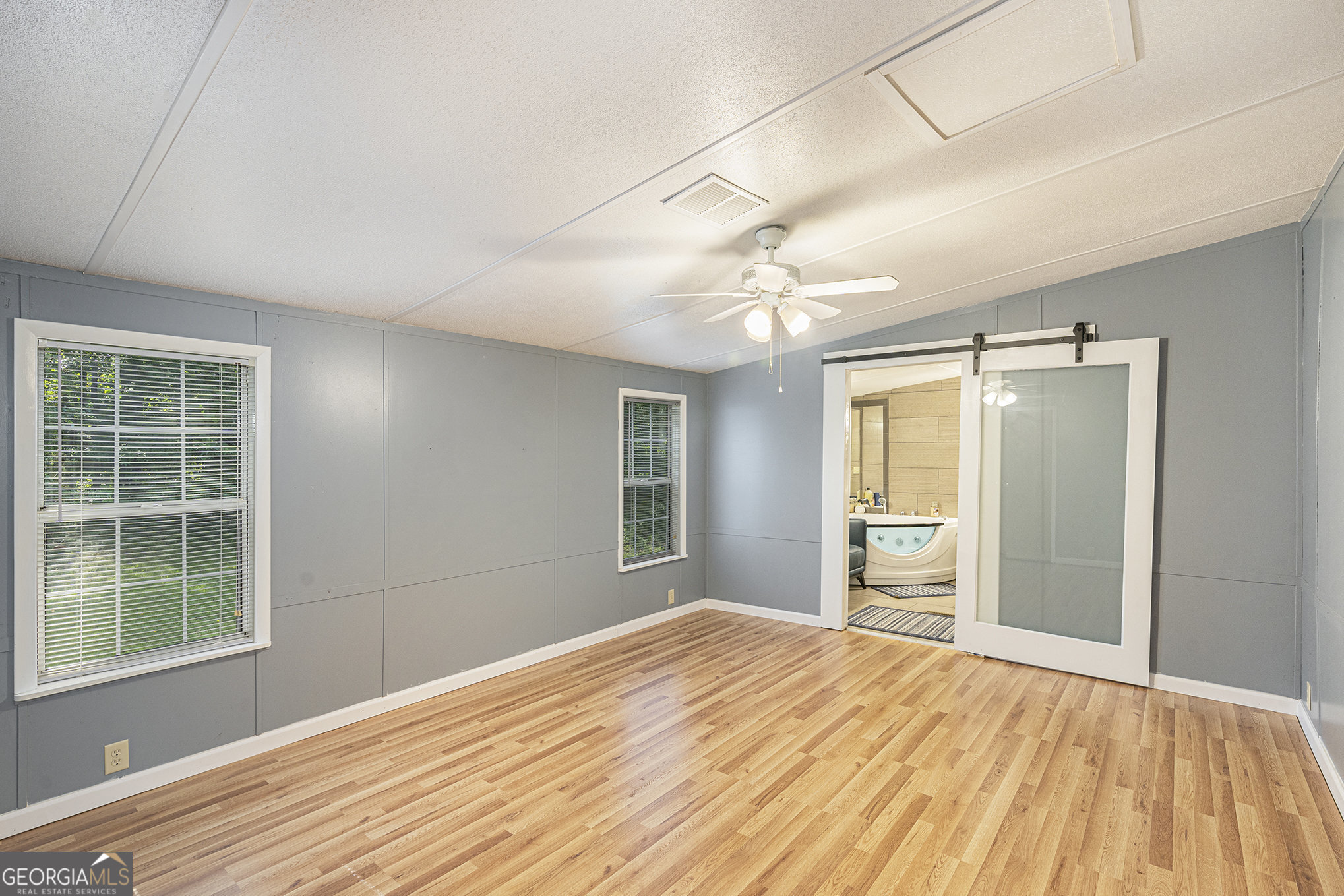 340 Loblolly Ridge Locust Grove, GA 30248 - Photo 14 of 26 a bedroom with a bed and a window