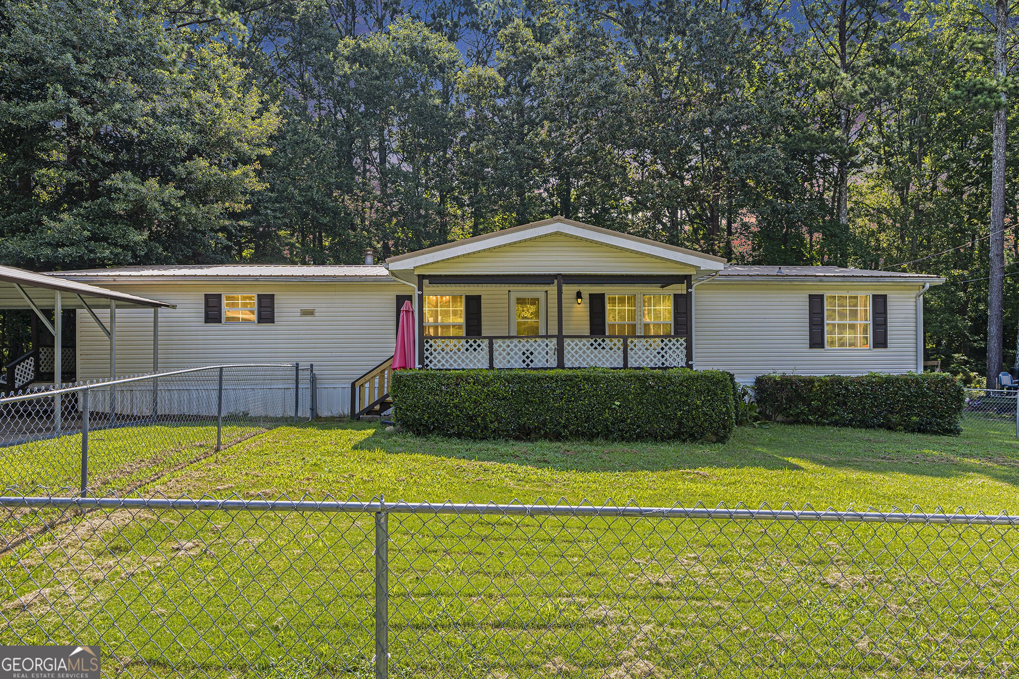 340 Loblolly Ridge Locust Grove, GA 30248 - Photo 2 of 26 a front view of a house with swimming pool