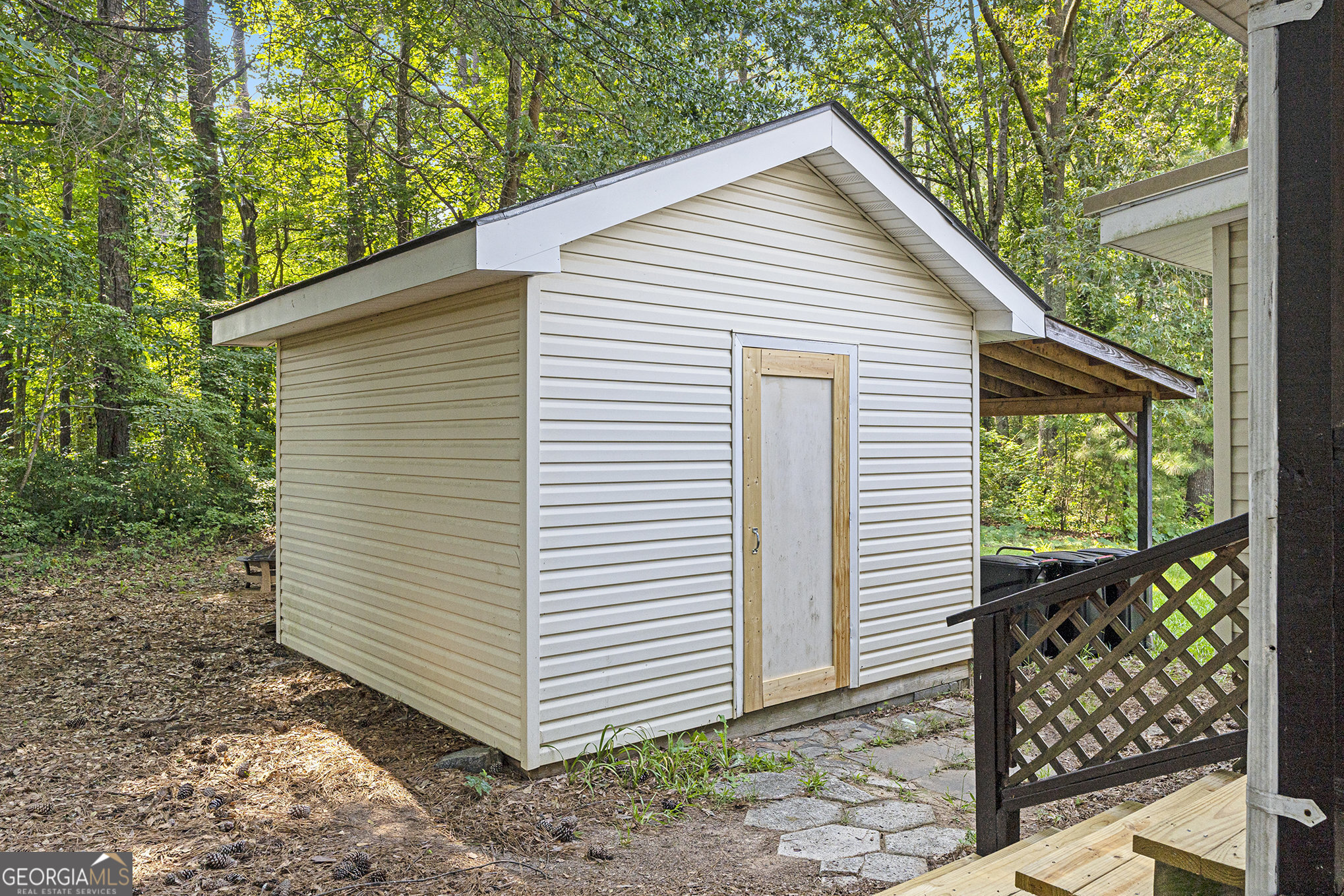 340 Loblolly Ridge Locust Grove, GA 30248 - Photo 23 of 26 a view of a small house with a backyard space