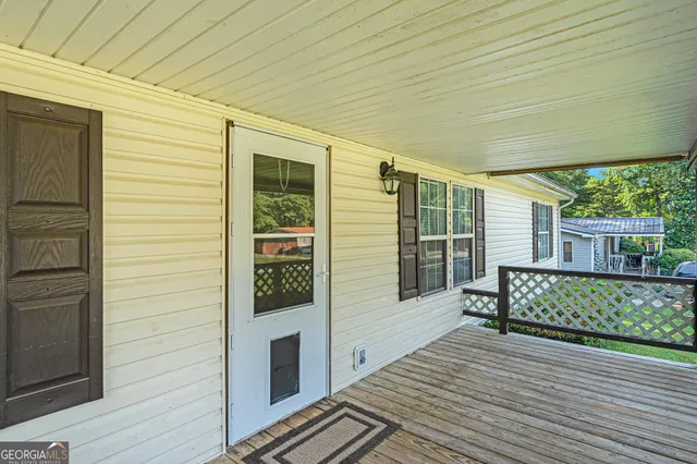 a view of a house with brick walls