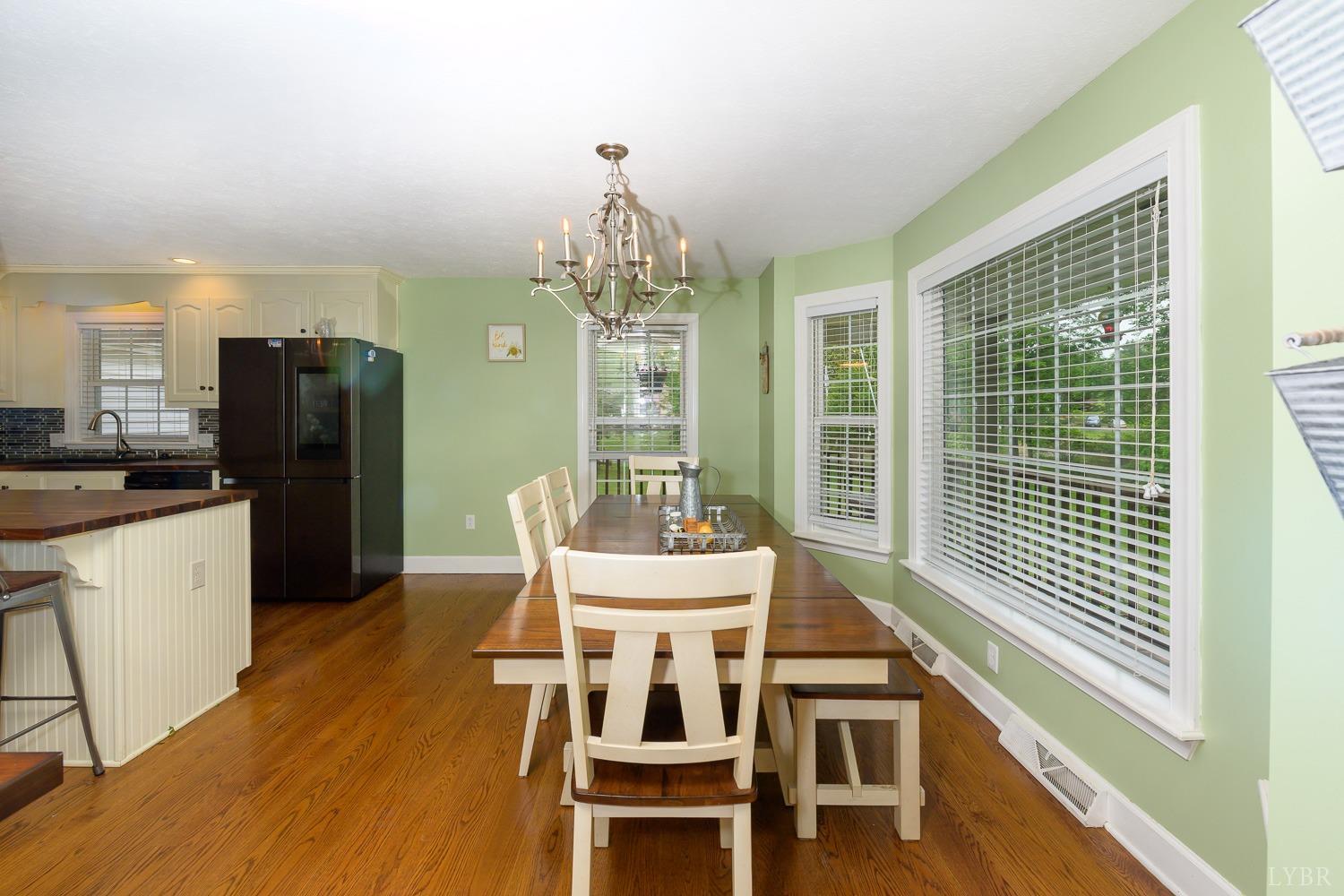 149 Locust Street Amherst, VA 24521 - Photo 14 of 86 a view of a dining room with furniture window and wooden floor