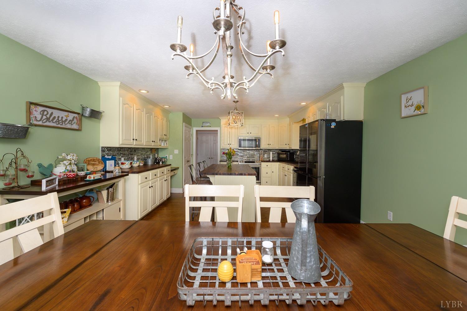 149 Locust Street Amherst, VA 24521 - Photo 15 of 86 a view of a kitchen with dining table and appliances
