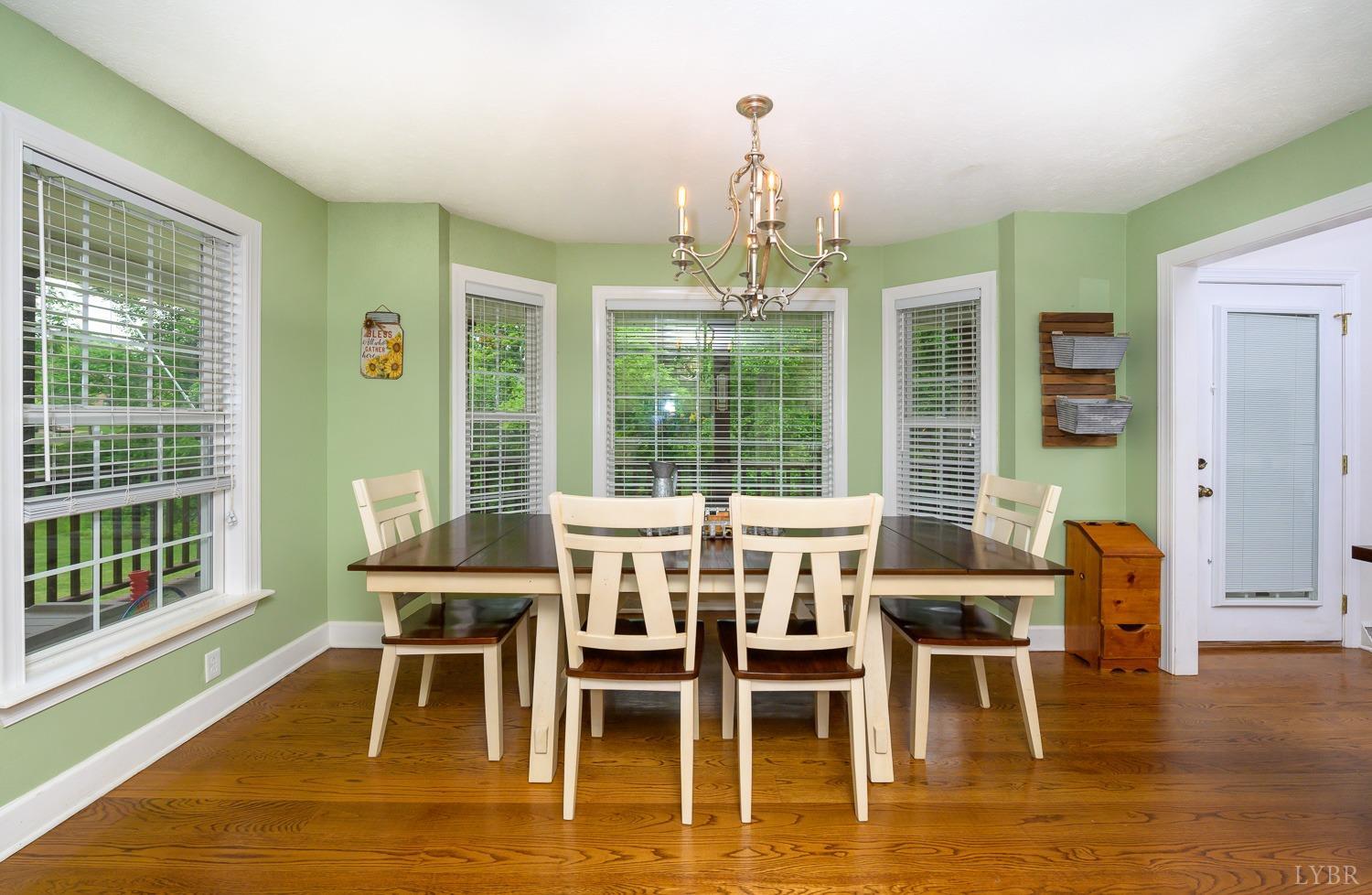 149 Locust Street Amherst, VA 24521 - Photo 16 of 86 a view of a dining room with furniture window and wooden floor