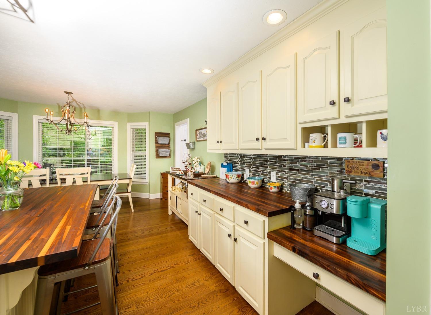 149 Locust Street Amherst, VA 24521 - Photo 18 of 86 a kitchen with wooden cabinets and sink