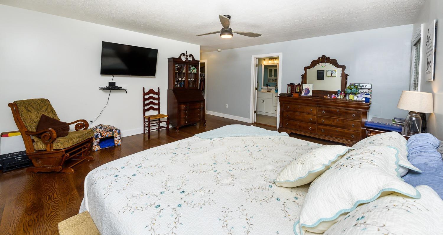 149 Locust Street Amherst, VA 24521 - Photo 30 of 86 a bedroom with a bed and a flat screen tv
