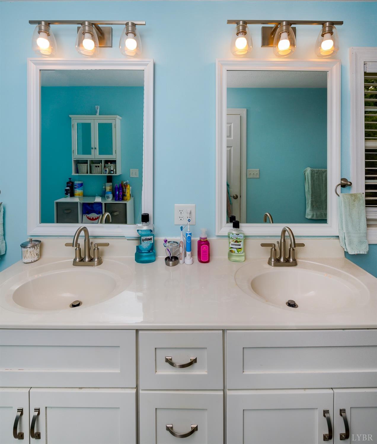 149 Locust Street Amherst, VA 24521 - Photo 35 of 86 a bathroom with vanity sink and a mirror