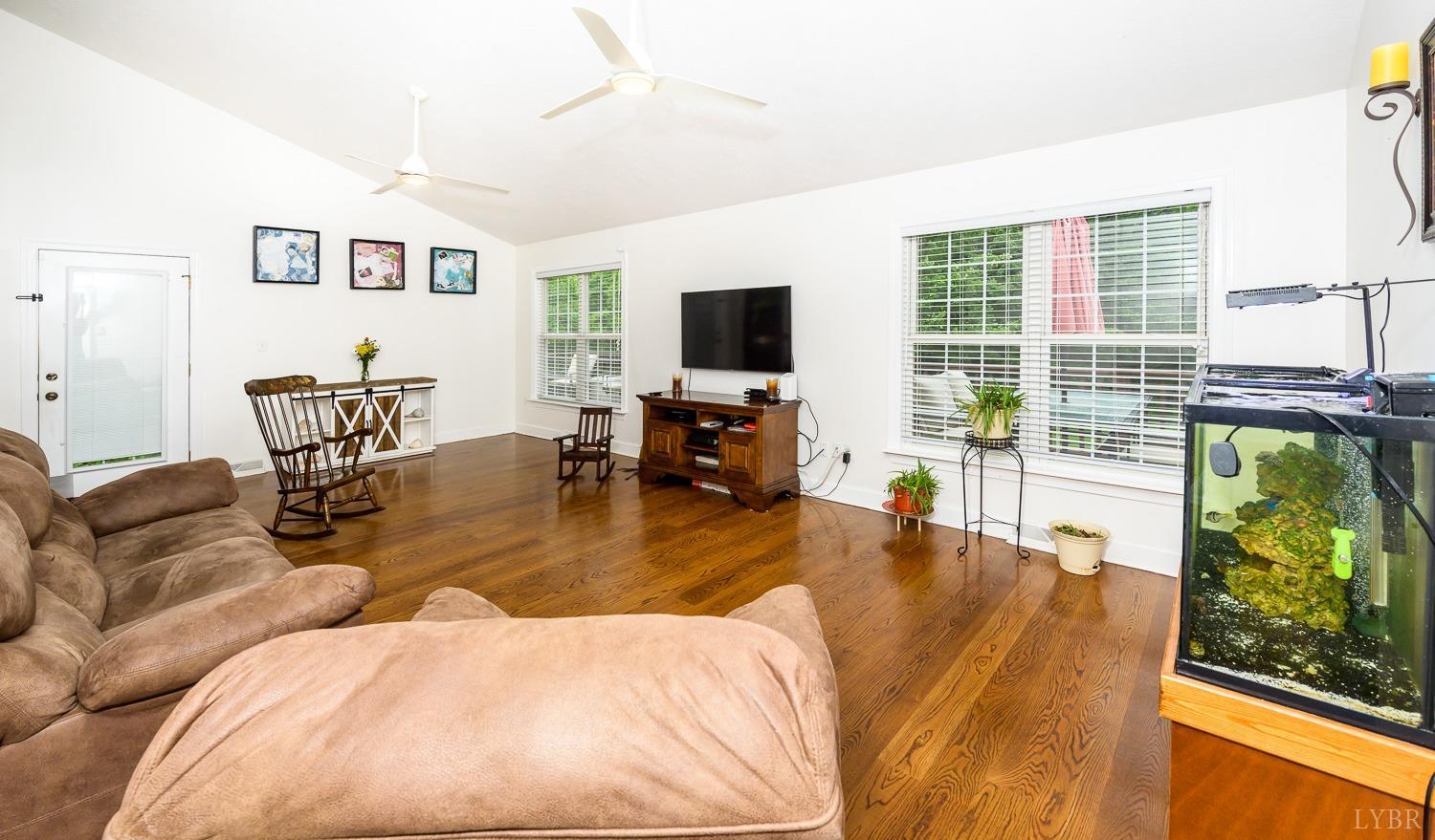 149 Locust Street Amherst, VA 24521 - Photo 38 of 86 a living room with furniture and a flat screen tv with wooden floor