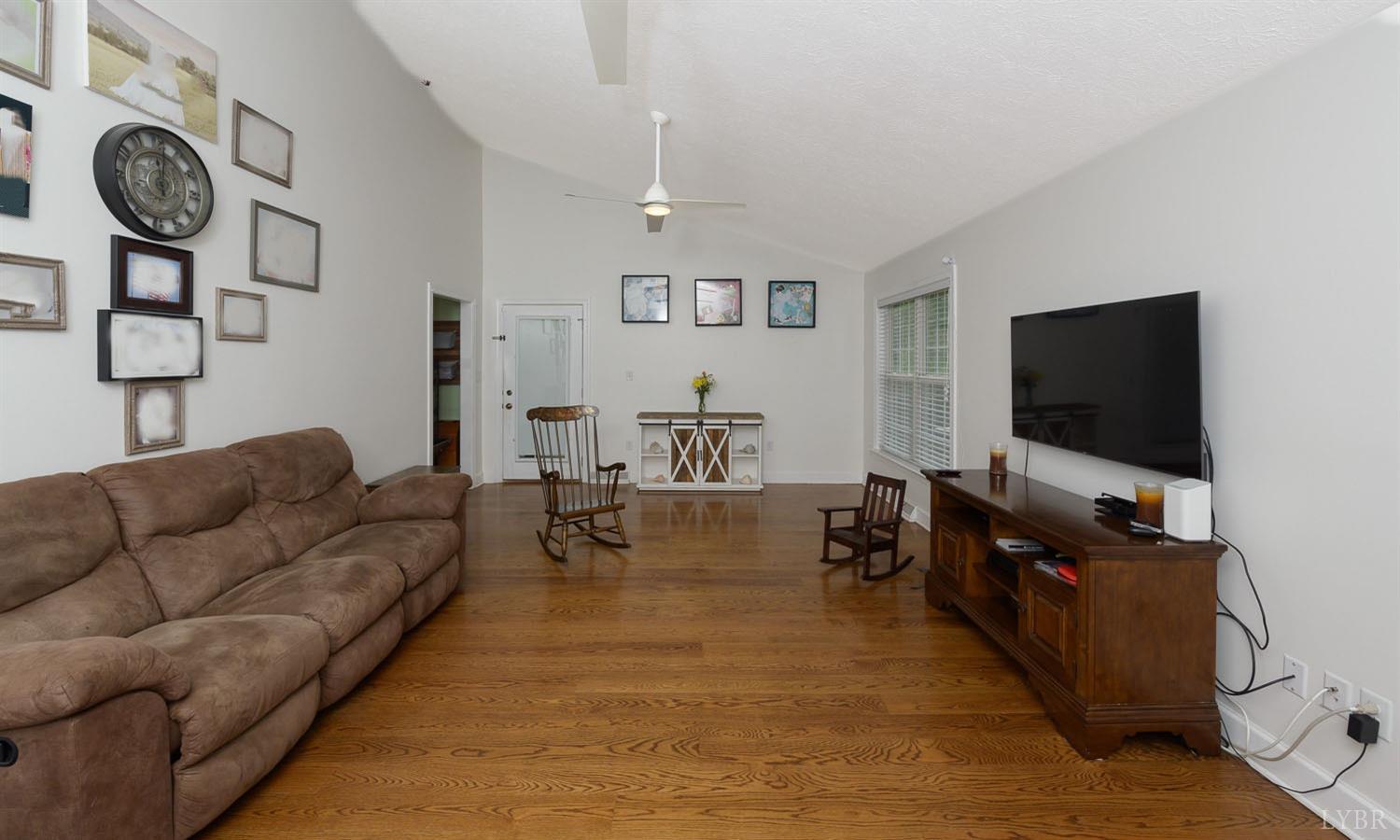 149 Locust Street Amherst, VA 24521 - Photo 39 of 86 a living room with furniture and a flat screen tv
