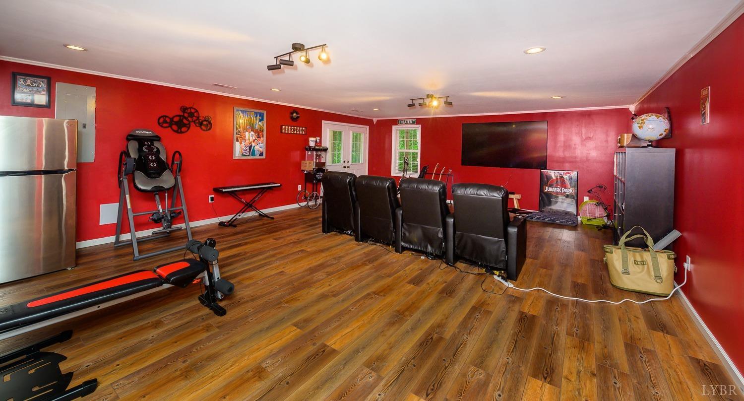 149 Locust Street Amherst, VA 24521 - Photo 54 of 86 a room with gym equipment and a flat screen tv