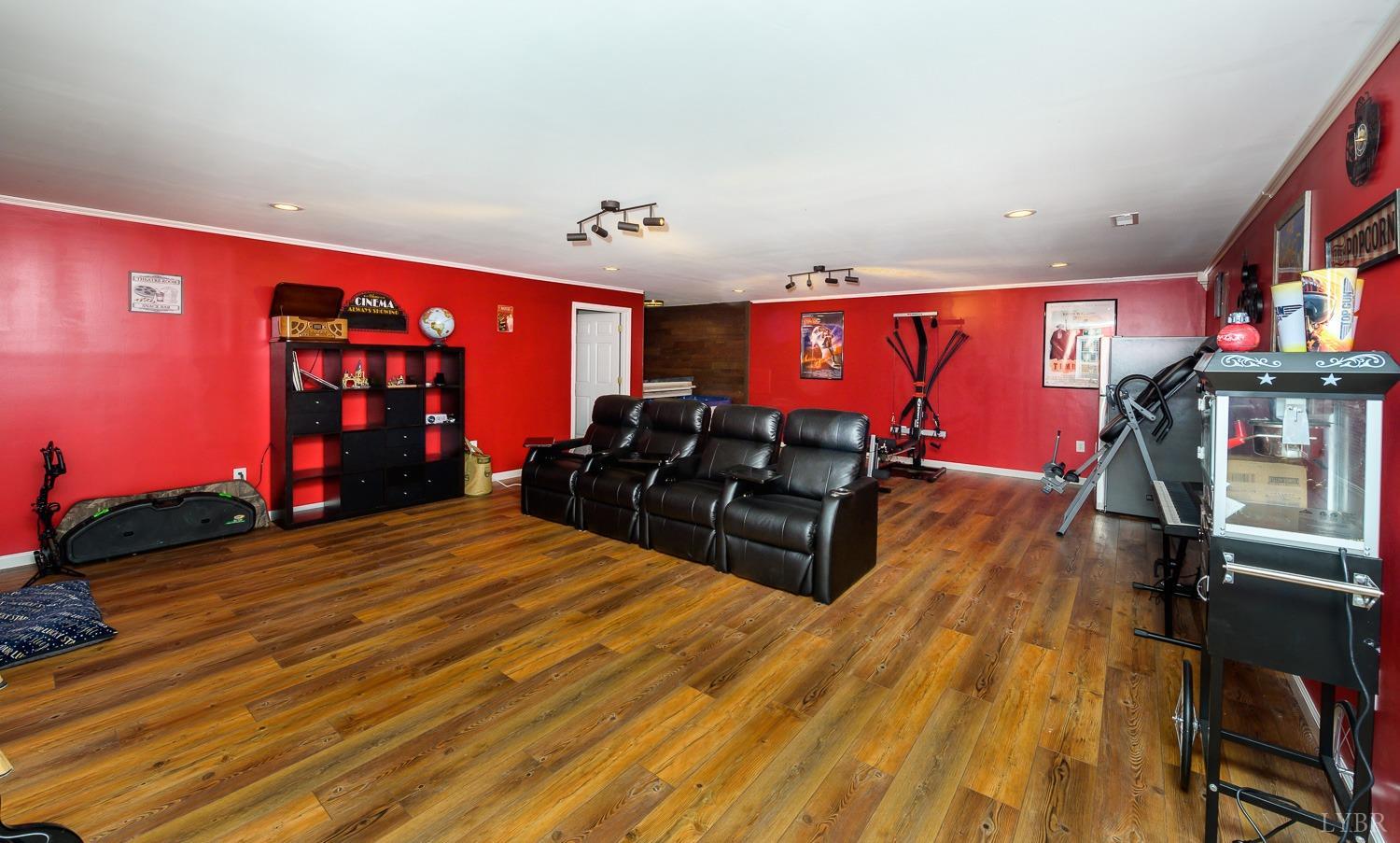 149 Locust Street Amherst, VA 24521 - Photo 58 of 86 a living room with furniture a flat screen tv and closet