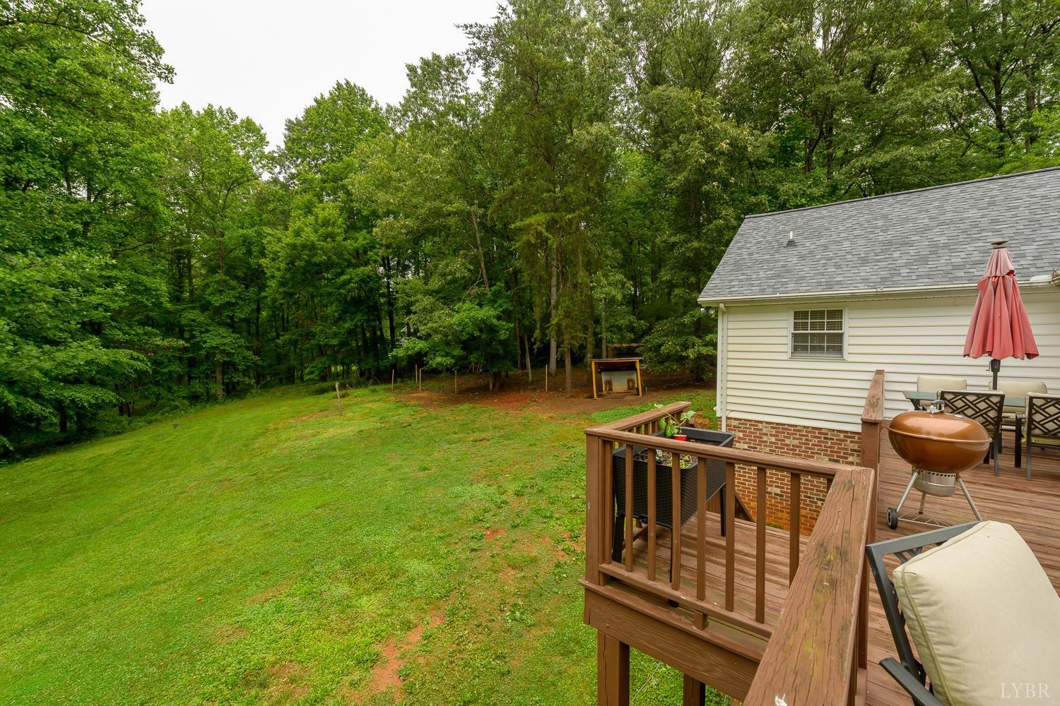 149 Locust Street Amherst, VA 24521 - Photo 62 of 86 a view of a deck with a table and chairs