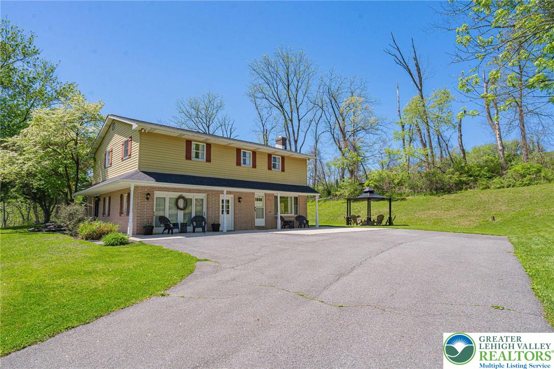 3857 Friedens Road Slatington, PA 18080 - Photo 1 of 75 This classic two-story residence offers a spacious driveway and a charming outdoor gazebo, perfect for relaxation.
