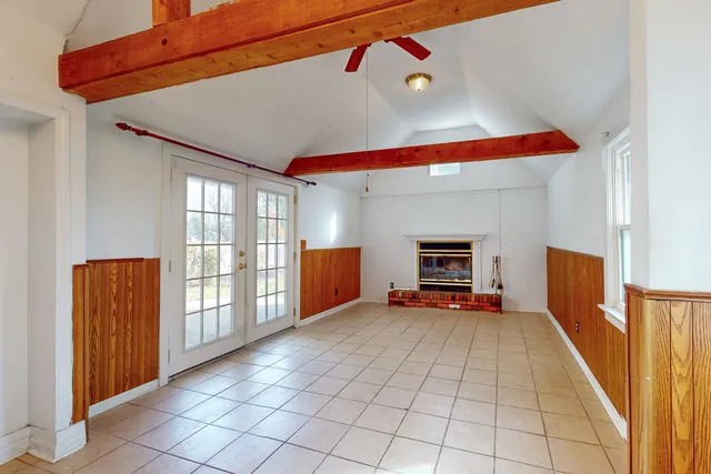 a view of a hallway with seating area