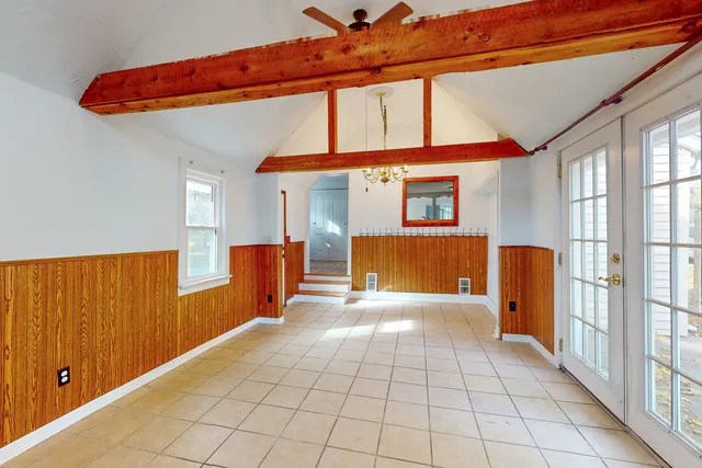 a spacious bedroom with a bed and a walk in closet