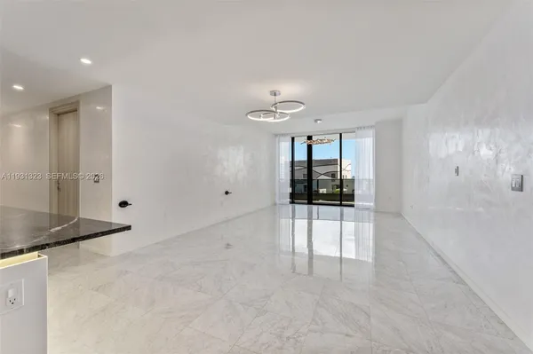 wooden floor in an empty room with a glass door