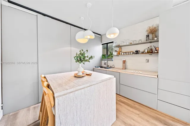 a kitchen with a sink and cabinets