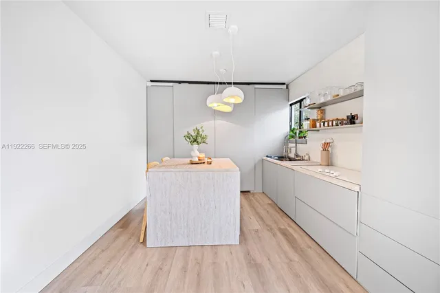 a room with cabinets and wooden floor