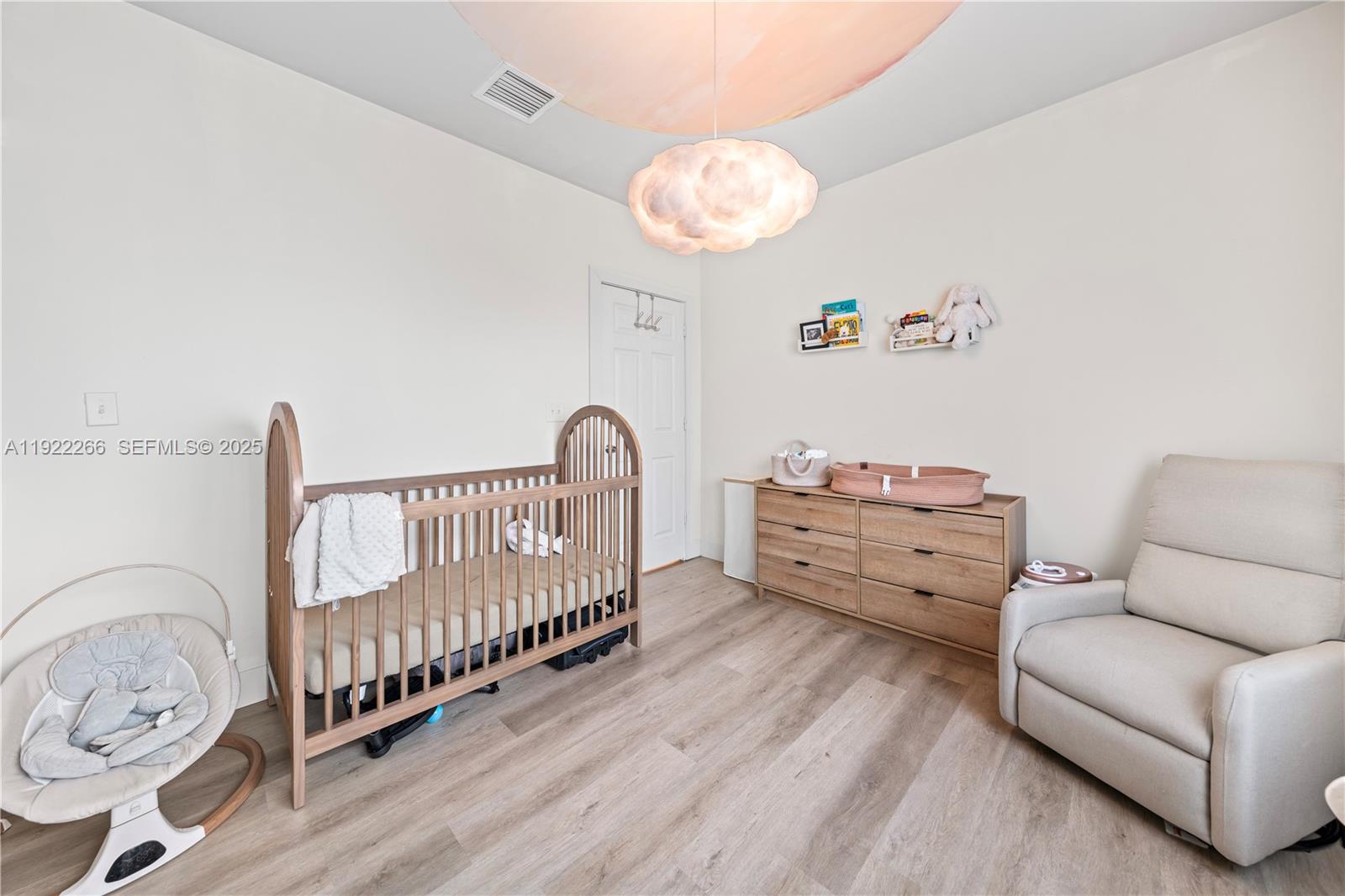 1910 Northwest 47th Street Miami, FL 33142 - Photo 22 of 32 a bedroom with furniture and a window