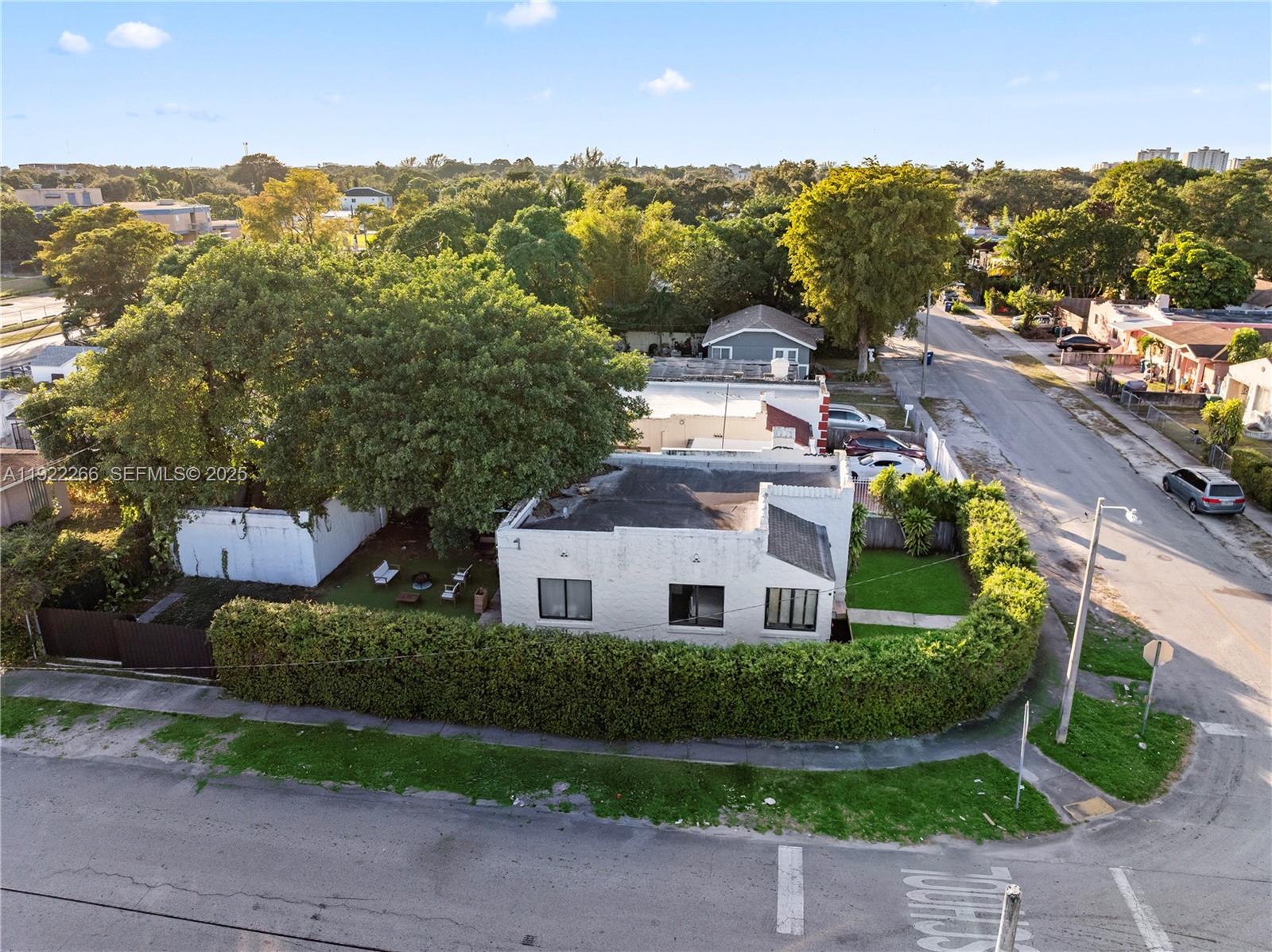 1910 Northwest 47th Street Miami, FL 33142 - Photo 4 of 32 a view of multiple houses with a yard