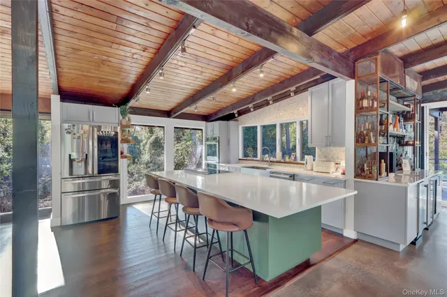a dining table with chairs and wooden floor