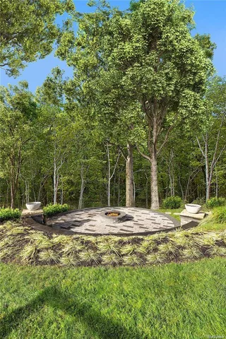 a view of a backyard with table and chairs