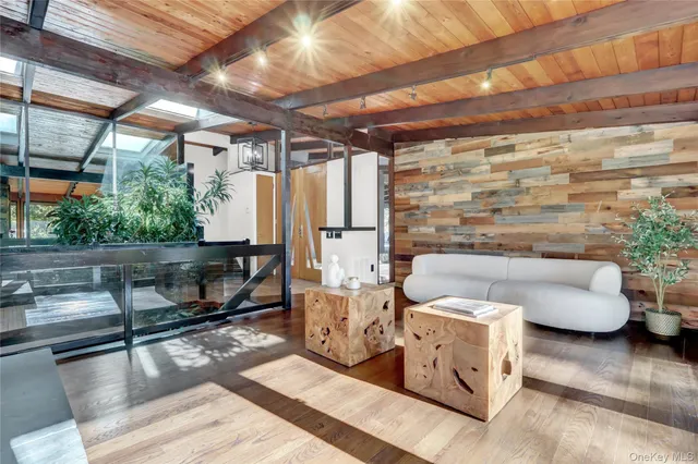 a outdoor living space with patio furniture and a wooden floor