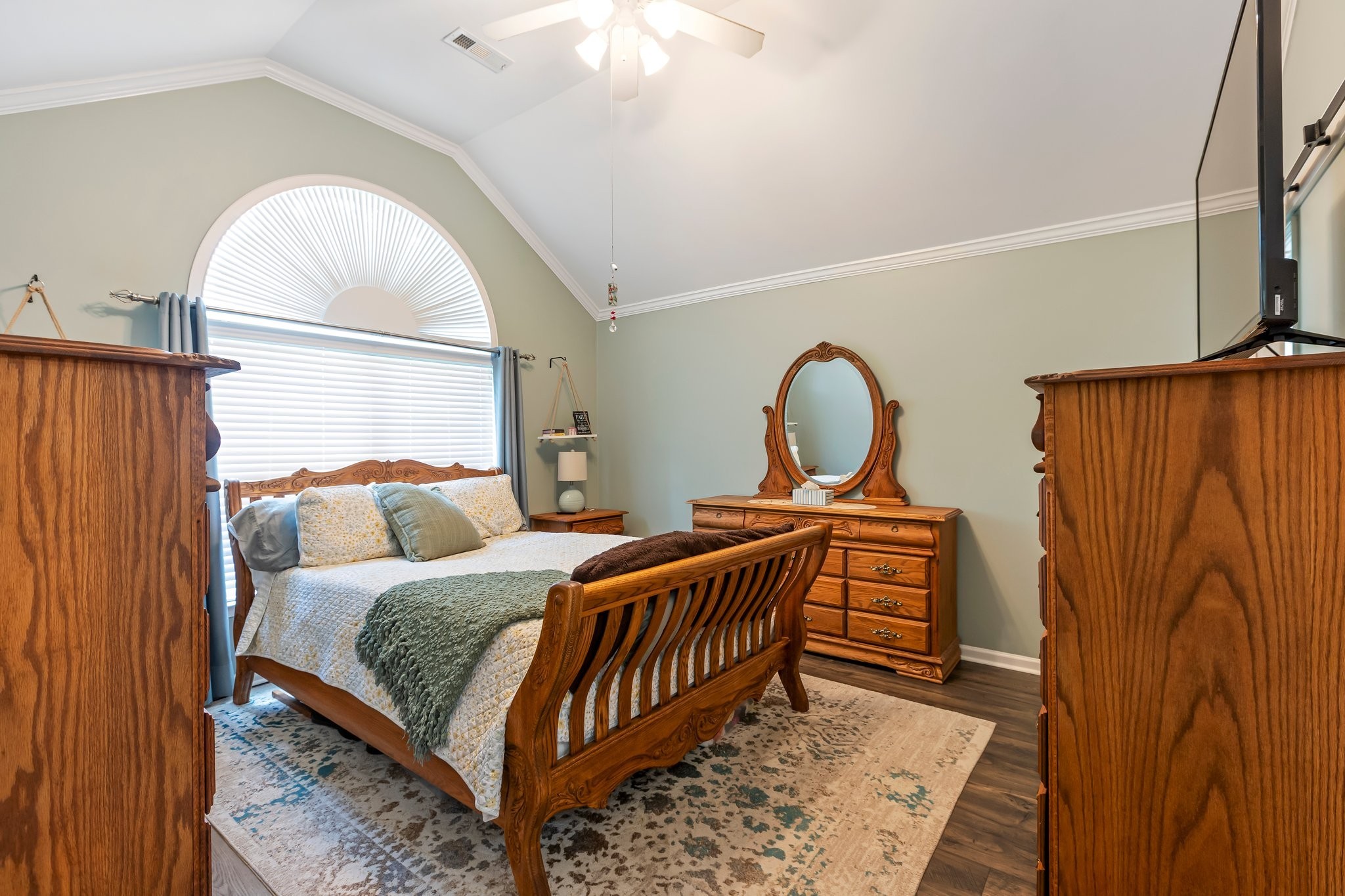 4025 Deer Run Trace Spring Hill, TN 37174 - Photo 15 of 54 a bedroom with a bed and a dresser with mirror