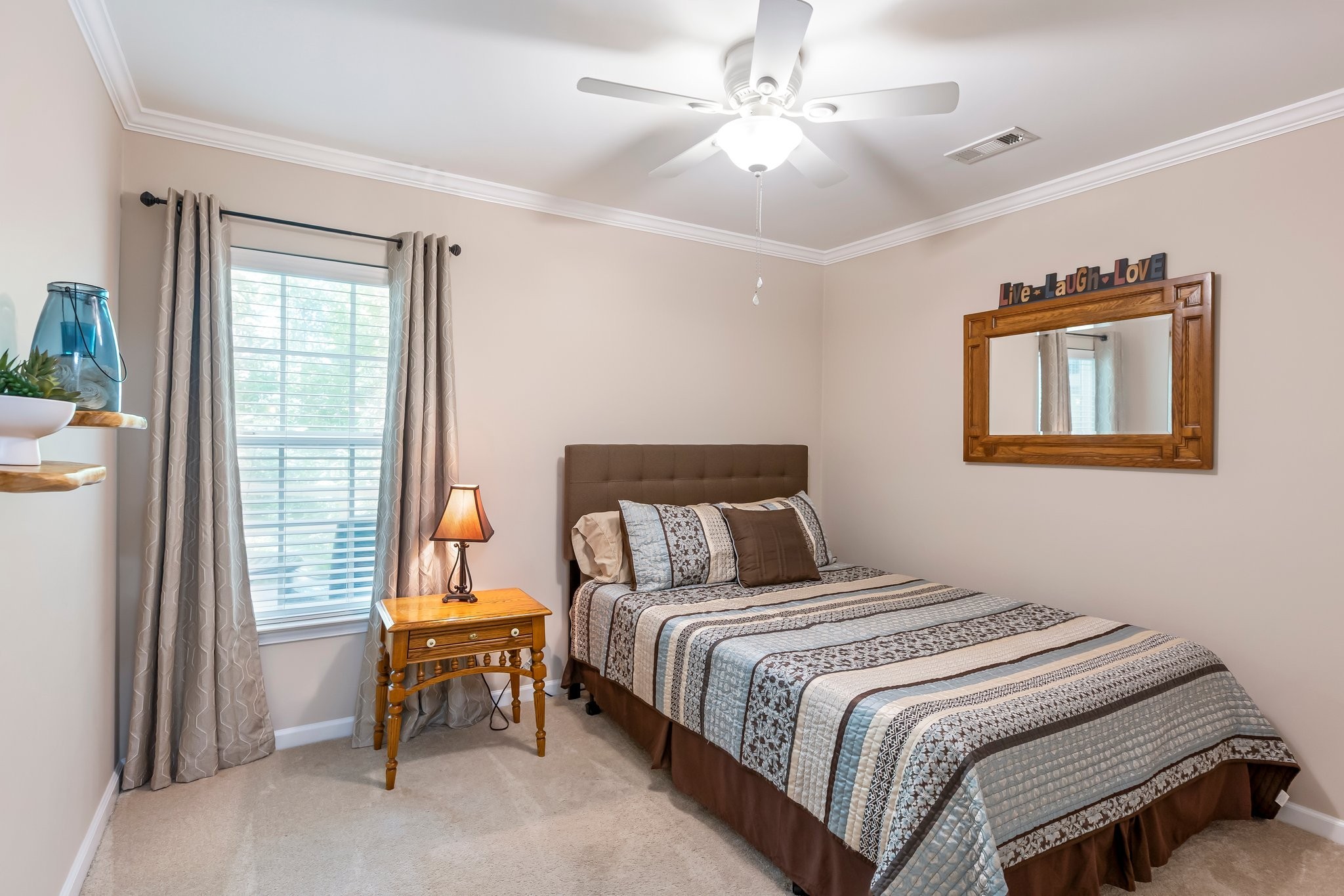 4025 Deer Run Trace Spring Hill, TN 37174 - Photo 20 of 54 a bedroom with a bed and a chandelier