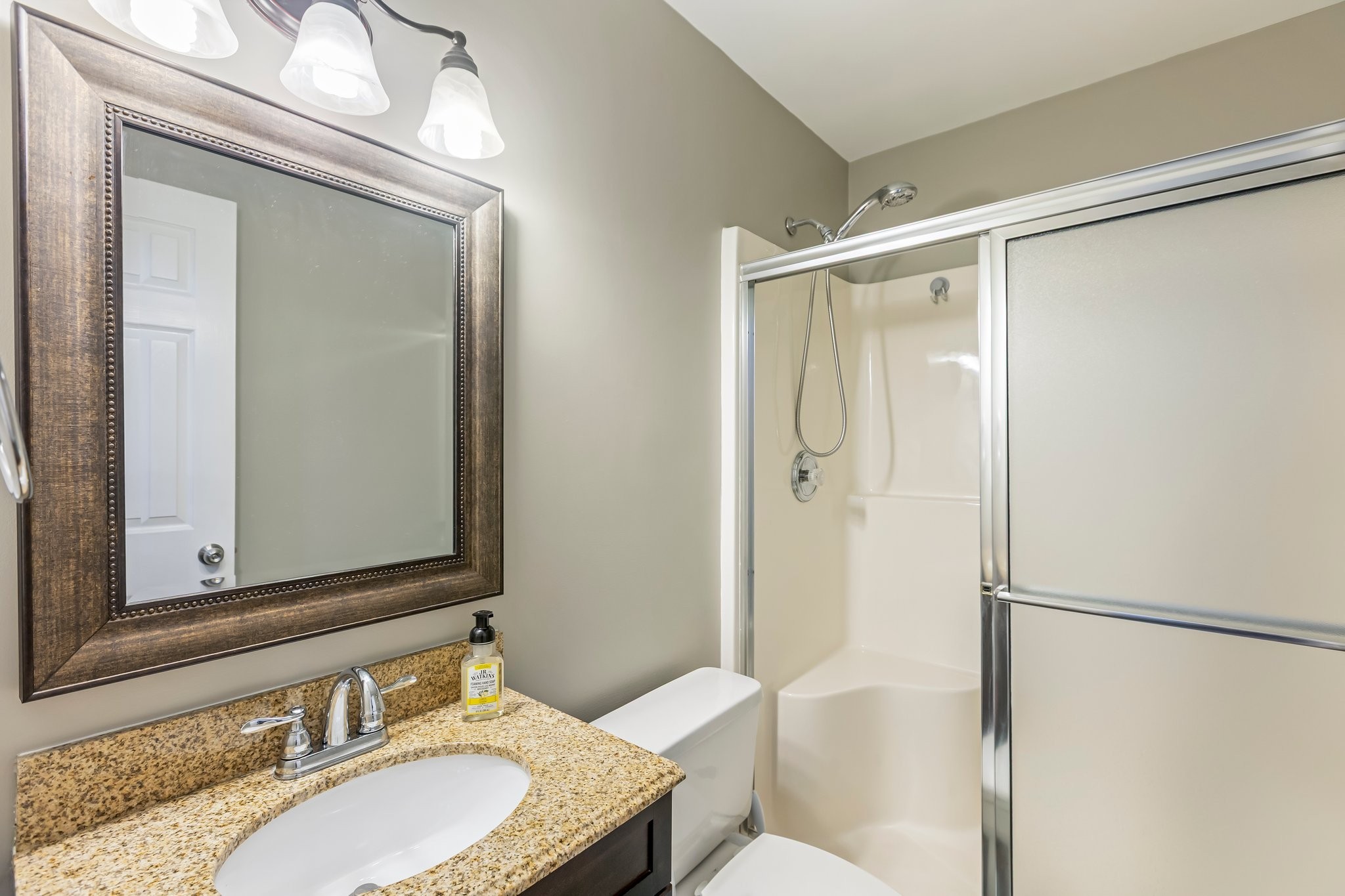 4025 Deer Run Trace Spring Hill, TN 37174 - Photo 22 of 54 a bathroom with a granite countertop shower sink and mirror