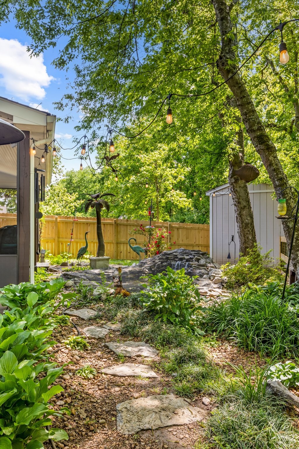 4025 Deer Run Trace Spring Hill, TN 37174 - Photo 36 of 54 a view of a backyard with large trees and plants