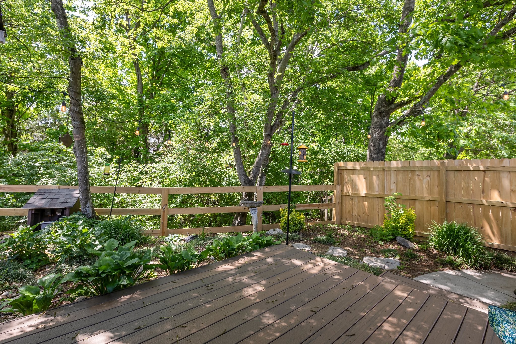4025 Deer Run Trace Spring Hill, TN 37174 - Photo 41 of 54 a backyard of a house with lots of green space and trees all around
