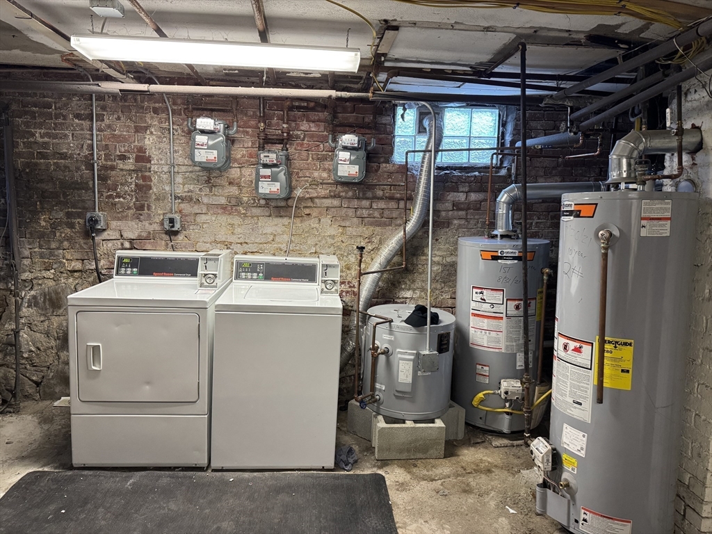 289 Chelsea Street Boston, MA 02128 - Photo 15 of 23 a utility room with dryer and washer