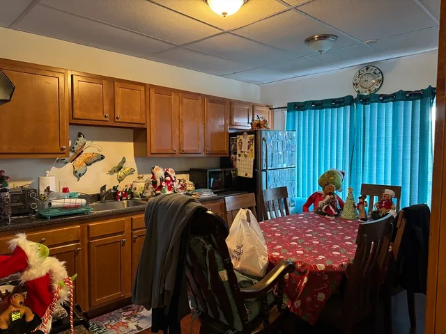 a bed room with a bed and a painting on the wall