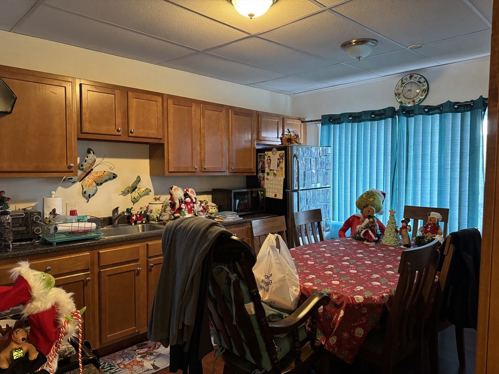 289 Chelsea Street Boston, MA 02128 - Photo 18 of 23 a outdoor kitchen with a sink dining table and chairs