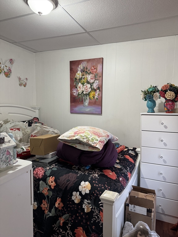 289 Chelsea Street Boston, MA 02128 - Photo 19 of 23 a bed room with a bed and a painting on the wall