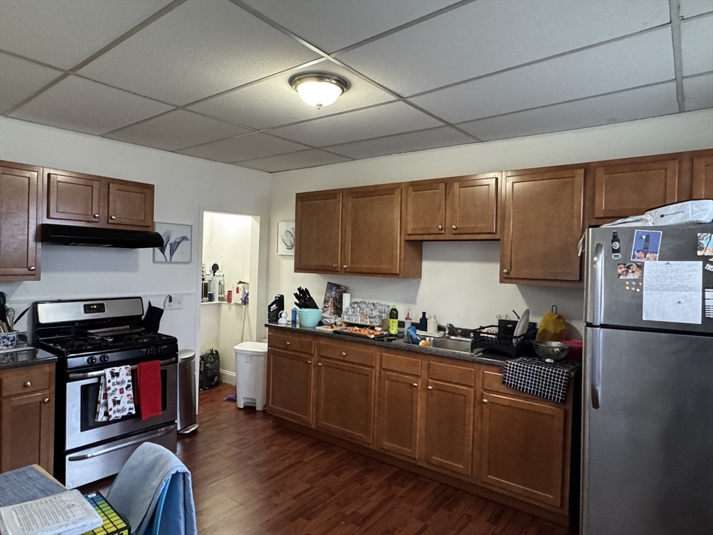 289 Chelsea Street Boston, MA 02128 - Photo 5 of 23 a kitchen with stainless steel appliances granite countertop a stove sink and cabinets