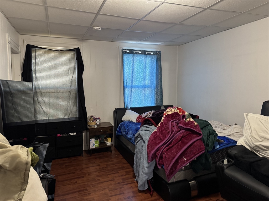 289 Chelsea Street Boston, MA 02128 - Photo 8 of 23 a bedroom with a bed and a mirror